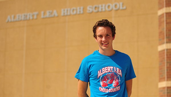 Logan Callahan, a returning letter winner on Albert Lea’s boys’ cross country team, stands in front of Albert Lea High School before practice. The Tigers will compete at Eastwood Golf Course in a meet hosted by Rochester Mayo today at 5:30 p.m. — Micah Bader/Albert Lea Tribune