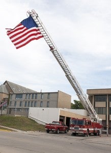 The American flag waves from the top of the Albert Lea Fire Department ladder truck Wednesday afternoon in commemoration of the Sept. 11 attacks.  --Sarah Stultz/Albert Lea Tribune