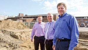 From left, Nate Jansen, Kelly Wadding and Dale Hicks of Quality Pork Processors Inc. stand in front of what will soon become a new clinic for QPP employees and their families. The primary care clinic will open in mid-October.  --Trey Mewes/Albert Lea Tribune