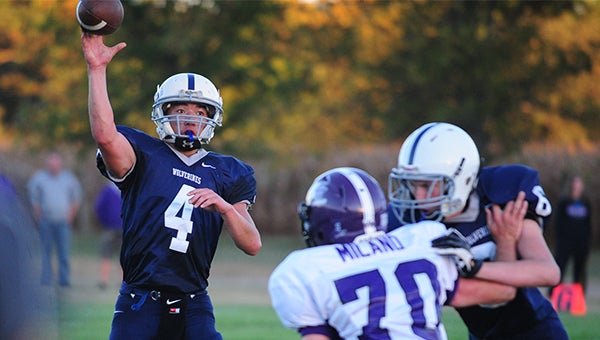 Christian Voss of Glenville-Emmons throws a pass Friday against Grand Meadow. Voss accounted for two touchdowns, but the Superlarks won 53-12. — Micah Bader/Albert Lea Tribune