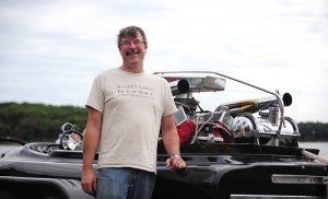 Roger Sparrow stands in front of his Sanger drag boat. Sanger has a crew of 12 people who help maintain his ride. The boat is powered by a 468-cubic-inch big block engine out of a 1974 Chevy pickup.