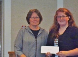 Sue Tripp, left, presents the 2013 American Association of University Women scholarship to Lana Howe. --Submitted