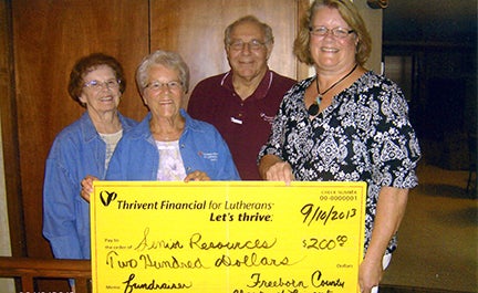 The Freeborn County chapter of Thrivent board members, JoAnn Haroldson, Nancy Ver Hey and Gary Hunnicutt presented a $200 supplemental funding check from Thrivent Financial for Lutherans to Annette Peterson of Senior Resources for its Deuces Wild Dueling Pianos show on July 23.