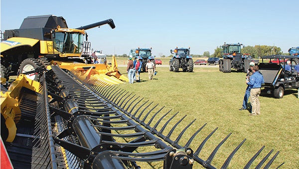 Farmers and New Holland representatives gather at Absolute Energy south of Lyle Wednesday during a field day. --Matt Peterson/Albert Lea Tribune