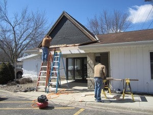 Contractors start on the exterior building renovation earlier this year.