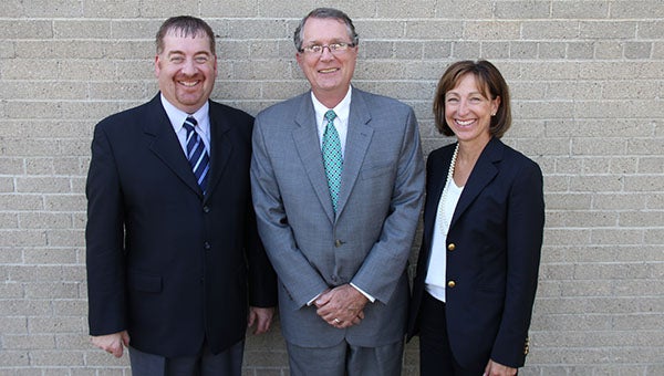 Freeborn-Mower Cooperative Services CEO Jim Krueger, Interstate Power & Light President Tom Aller and Minnesota Energy Resources President Barbara Nick stand together Tuesday at the Albert Lea Tribune.