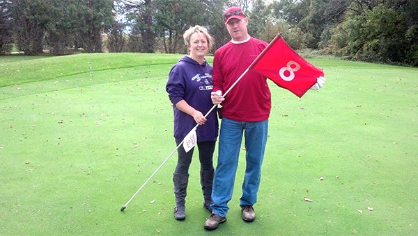 Craig Stickfort hit a hole-in-one on the 171-yard eighth hole by using a seven-iron at Oak View Golf Course on Oct. 6. Angie Stickfort, left, Craig’s wife, witnessed the shot. — Submitted
