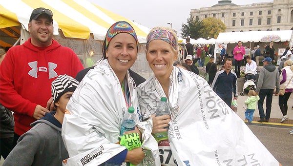 Kristi Kenis, left, competed in the Medtronic Twin Cities Marathon on Oct. 6 in overcast conditions with Amber Jensen. Both runners are from Albert Lea. Jensen graduated from Albert Lea High School in 1993, and Kenis followed in 1994. Kenis, a former cross country and track and field athlete for the Tigers, finished the 26.2-mile course in 4:26.23. The race was Kenis’ first marathon, and she wants to compete again with a faster time, she said. While training for the race, the duo ran up to 18 miles a day. — Submitted