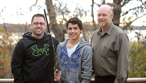 Karter Kenis, 12, from Albert Lea stands with his .30-06 hunting rifle between his father, Paul Kenis, left, and his grandfather, Brad Edwin. The trio went big-game hunting in western Wyoming, and Karter shot a pronghorn antelope buck. — Micah Bader/Albert Lea Tribune