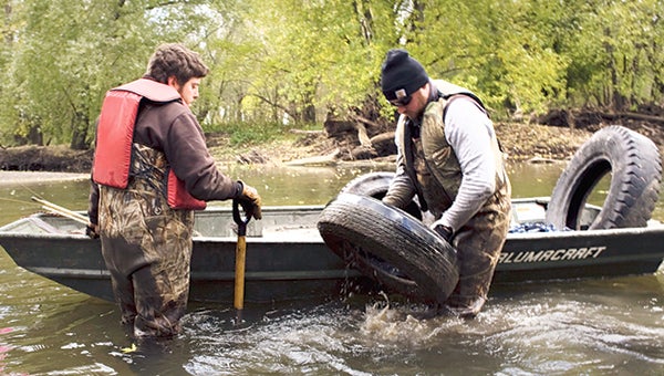 The Conservation Corps of Iowa and Minnesota recently pulled about 220 tires from a stretch along the Cedar River south of Austin. Since 2011, volunteers have pulled nearly 700 tires from the river in the area. --Nate Howard Photography