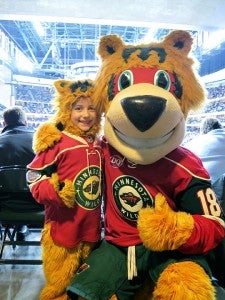Karli Johnson stands with Nordy, the mascot of the Minnesota Wild, Wednesday at the Xcel Energy Center in St. Paul after she was chosen to be the mini mascot by winning a contest at Dairy Queen. Johnson is from St. Michael.  She is the granddaughter of Rick and Karen Boyer of Albert Lea and the great-granddaughter of Ed and Alberta Brandt of Albert Lea. The game was one day after Johnson’s sixth birthday, and the Wild delivered her a 2-1 shootout win over the Toronto Maple Leafs. — Submitted