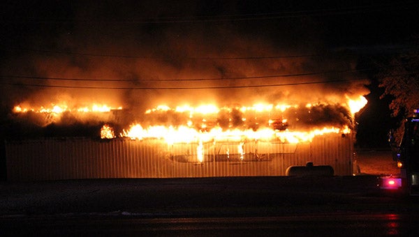 Fire engulfs a pole barn behind Subway on East Main Street at 6:30 a.m. Monday. — Tim Engstrom/Albert Lea Tribune