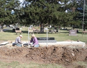 Workers from Northern States Masonry work on concrete footings for the memorial near Myrtle. -- Submitted