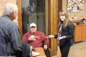 Lisa Hanson speaks to customers Wednesday at Prairie Wind Coffee in downtown Albert Lea. She and her husband, Vern, bought the shop in November.