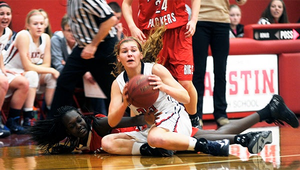Albert Lea's Sydney Rehnelt recovers a loose ball from Austin's Ruth Koang in Ove Berven Gym Tuesday. — Rocky Hulne/Albert Lea Tribune    