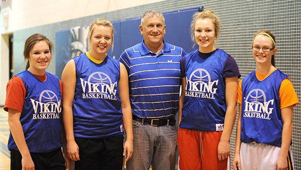 The Northwood-Kensett girls’ basketball team is off to its best start in school history and a No. 12 ranking in the Iowa Girls’ High School Athletic Union polls. From left are Taryn Van Ryswyk, Kayla Branstad, Vikings head coach Daryl Love, Hattie Davidson and Katelyn Jaspers. —Micah Bader/Albert Lea Tribune