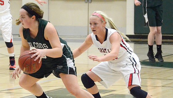 Faribault's Jenna Wetzel tries to get around Albert Lea's Bryn Woodside during the first half on Tuesday at Nomeland Gymnasium.  — Miles Trump/Faribault Daily News