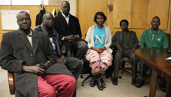 South Sudanese refugees from Albert Lea sit down to speak with the Albert Lea Tribune on Wednesday. They are, left to right, David Gatkuoth, James Chol, Chang Ruach, Martha Gony, Lam Riang and Peter Cham. -- Tim Engstrom/Albert Lea Tribune