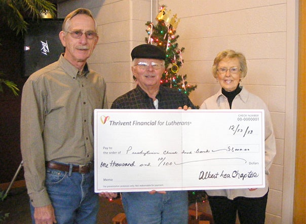 In an effort to help combat hunger in the area, Larry Trampel, center, of Thrivent Financial for Lutherans, presents a $1,000 check to Orv and Dorothy Simonsen of the Ecumenical Food Pantry. -- Submitted