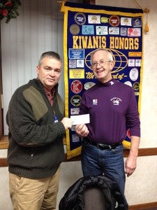 The Albert Lea Daybreakers Kiwanis made a donation to sponsor two youth bowling teams at Holiday Lanes. President Mike Funk, left, presents the donation to Loren Kaiser of Holiday Lanes. --Submitted