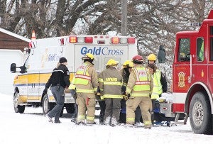 Gold Cross ambulance crews and Hayward and Albert Lea firefighters respond to a crash Thursday morning between a train and a FedEx truck. -- Sarah Stultz/Albert Lea Tribune