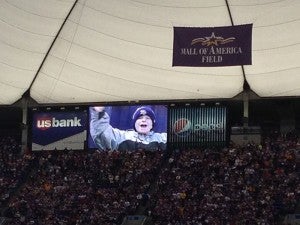 William Lawhead, a Southgate second-grader, smiles on the Jumbotron at the Metrodome Sunday during the final Vikings’ game at the stadium.