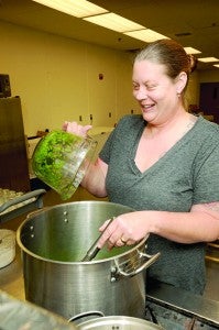 Kimberly Olson mixes ingredients together for one of her recipes.  