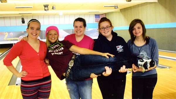 Bree Tlamka bowled her first sanctioned 300 game in the girls’ high school league at Holiday Lanes. From left are Brianna Oftedahl, Corissa Freeman, Angela Rieckens and Rachel Reichl. Tlamka is being held, and her average is 192. — Submitted