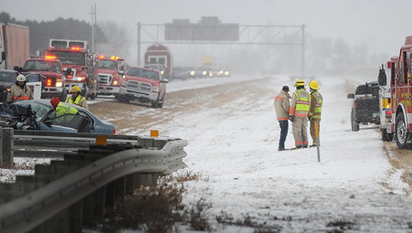Emergency personnel work the scene of a car accident on southbound Interstate 35 at the intersection with Interstate 90 Monday morning. — Drew Claussen/Albert Lea Tribune 