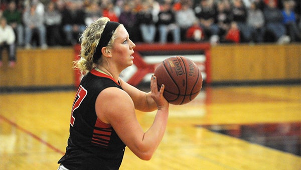 Jade Schultz of NRHEG spots up to shoot a 3-pointer Saturday against Hayfield at New Richland. Schultz hit five 3-pointers and scored 22 points in NRHEG's 79-44 win. — Micah Bader/Albert Lea Tribune   