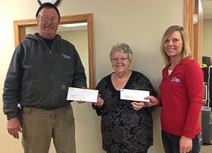 Curt Korn and Lori Finke of Watonwan Farm Service Co. present a check to Barb Stenzel, center, of the Alden Area Food Shelf for $2,900 as an initial donation in WFS’s pledge to donate to area food shelves. The food shelf also received a matching funds check from the Land O’Lakes Foundation for the same amount. --Submitted