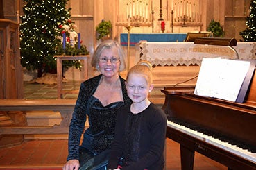 Music students of Sharon Astrup-Scott presented a Christmas recital at 2 p.m. Dec. 22 at First Lutheran Church in Albert Lea. Pictured with Astrup-Scott is Halle Morris, daughter of Wesley and Alissa Morris. Halle is a piano student. Voice, piano, violin, viola and cello students and audience participation created a festive Christmas atmosphere. A reception was held following the recital. --Submitted