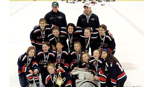 The Albert Lea U10 girls’ hockey team won its home tournament on Jan. 5. Front row from left are Malana Thompson, Laynee Behrends, Maddie Schneider (lying down), Allison Dulitz, Jaiden Venem, Sadie Neist, Josie Venem and Esther Yoon. Middle from left are Lucy Sherman, Taylor Stanek, Delani Hernandez, Lauren Cookle and Ally Rasmussen. Back row from left are coaches Dan Rasmussen and Troy Neist. — Submitted