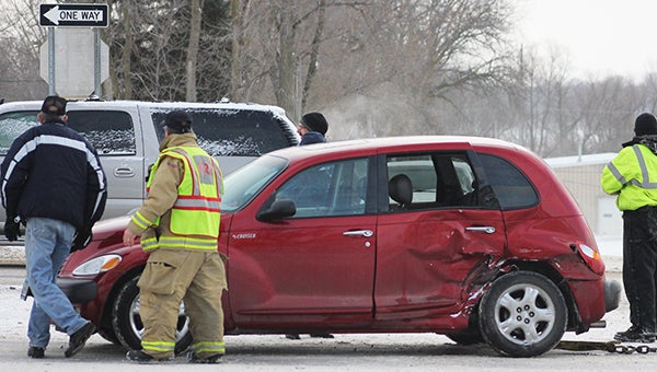 Emergency crews respond to a crash at the intersection of St. Peter Avenue and East Main Street in Albert Lea Tuesday afternoon. -- Sarah Stultz/Albert Lea Tribune 
