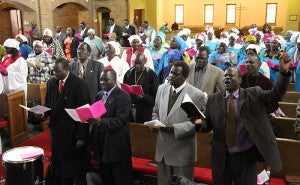 South Sudanese men and women sing Saturday morning at First Presbyterian Church of Albert Lea.