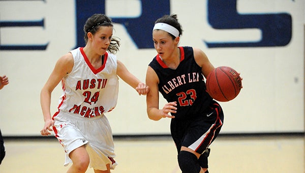 Megan Kortan of Albert Lea drives to the basket Friday at home against Austin. — Micah Bader/Albert Lea Tribune