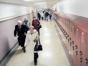 Shareholders head to Knowlton Auditorium for the annual Hormel shareholders meeting Tuesday night at Austin High School. 