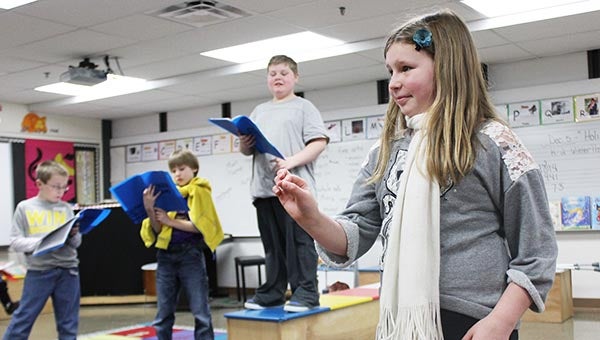 Sibley Elementary School student Kali Benson practices her role as Painter during a practice for “Beauty and the Beast” Wednesday afternoon at the school while other students look on. Two professional actors from Prairie Fire Children’s Theatre have worked with the students this week to learn the play. Performances will be at 7 p.m. Friday and at 10:30 a.m. Saturday at the Southwest Little Theatre. The cost for the performance is $5 for adults and $2 for students. --Sarah Stultz/Albert Lea Tribune