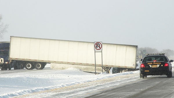 A jackknifed semi rests in the median of Interstate 35 about five miles south of Albert Lea.