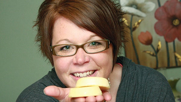 Sara McGuire holds lotion bars that she made. --Brandi Hagen/Albert Lea Tribune