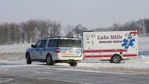 Members of the Lake Mills Ambulance Service wait patiently Thursday east of Lake Mills near a standoff with authorities. -- Tim Engstrom/Albert Lea Tribune