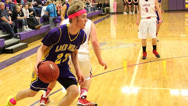 Lake Mills' Taylor Throne drives the baseline during Friday's game against West Hancock. — Drew Claussen/Albert Lea Tribune 