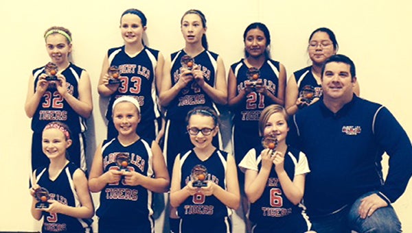 The Albert Lea sixth-grade traveling girls’ basketball team took fourth place Jan. 18 at the Big Nine Conference Tournament in Rochester. Front row from left are Joci Strom, Sierra Jensen, Alexis Heavner, Leslie Farr and coach Tim Butt. Back row from left are Sydney Nelson, Ashley Butt, Turena Schultz, Atziri Torres and Jazmin Morales. Samantha Skarstad and Kayden Kirchner were not pictured. — Submitted