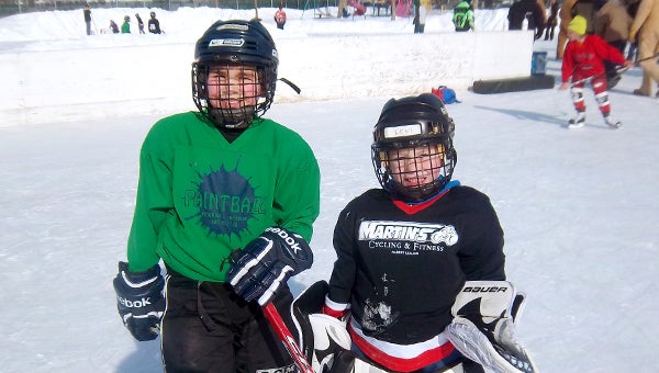 Spencer Jones, left, and Levi Senne were Players of the Game in the matchup between team Paintball and Martin’s Cycling and Fitness in the Mites III Division Feb. 1 during the Albert Lea Hockey Association’s Albert Lea Hockey Day at Hayek Park. — Submitted