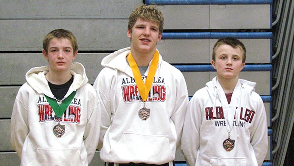 From left are Ty Harms, Tanner Palmer and Zach Glazier. The trio brought home hardware Feb. 1 after competing in the ninth-grade State tournament in Champlin. Harms was 4-1 and took fifth place in the 113-pound weight class. Glazier was 3-1 and earned a third-place finish in the 100-pound weight class. Palmer was 3-2 and took sixth place in the 170 pound weight class. Brody Nielsen also qualified for the tournament. — Submitted