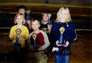 Front row from left are Ella, Hunter and Elise Anderson. The trio took first place in the Pepsi Saturday Youth Bowling League at Holiday Lanes. Back row from left are Trent Lester and Dan Fischer. Lester and Fischer finished second. — Submitted