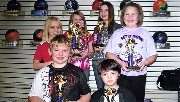 The winners of the Friday Nite League stand at Holiday Lanes. Front row from left is the third-place team of Brandon Espe and Kaidin Barnes. Back row from left are Sarah Heggestad, Kayla Christenson, Kaitlyn Komoszewski and Macy Williams. Christenson and Komoszewski were league champs, and Heggestad and Williams took second place. Carissa Nelson, Cassie Nielsen and Luke Lunning are not pictured. — Submitted