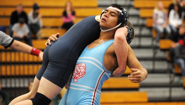 Santana Acosta of Albert Lea carries his opponent from Janesville-Waldorf-Pemberton/Waterville-Elysian-Morristown before pinning him in 3 minutes and 41 seconds. — Micah Bader/Albert Lea Tribune