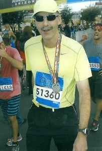 Dennis Dieser wears a medal after completing the Rock ‘n’ Roll Marathon in Phoenix, Ariz. He finished in 3 hours, 27 minutes and 6 seconds to qualify for the Boston Marathon. — Submitted