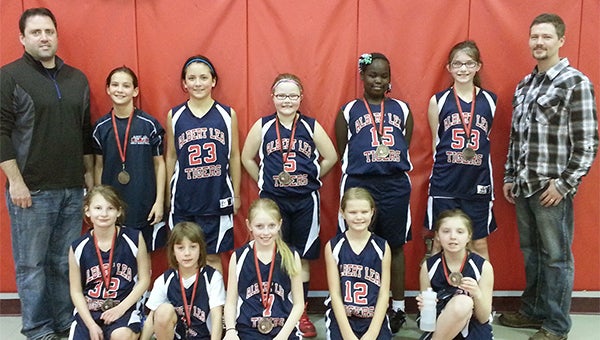 The Albert Lea Blue fourth grade girls’ basketball team took third place out of eight teams Feb. 8 in a tournament at Alden. Front row from left are Trinity Haukoos, Morgan Luhring, Stephanie Vogt, Hailey Strom and Lydia Loyd. Back row from left are coach Paul Kenis, Annika Veldman, Kendall Kenis, Allyson Butt, Cuddear Thoat, Adriana Brumbaugh and coach Tony Strom. Coach Tina Strom and Mackenzie Romer are not pictured. Other teams that participated at the tournament were Albert Lea White, Alden, Bethlehem Academy, Austin, NRHEG, Blue Earth and Central Springs. — Submitted